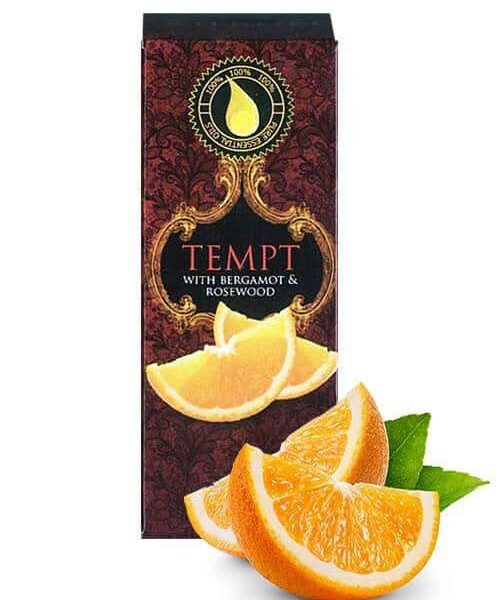 tempt 10ml essential oil box with slice of orange in the foreground